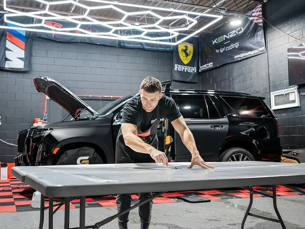 Paint protection film being installed on a vehicle panel